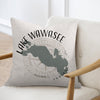 Pillow with Lake Wawasee Indiana map and compass design on a light beige background.