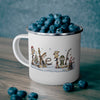 White mug filled with blueberries, decorated with a festive winter scene.