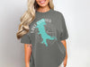 Dark grey t-shirt with turquoise lake outline and compass graphic saying "Lake Quivira Kansas".