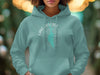 Teal hoodie with "Lake Cascade Idaho" text and compass rose graphic.