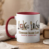 White mug with maroon interior and handle, featuring "Lake Life" graphic and "Mountain Island Lake North Carolina".