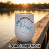A white insulated wine tumbler featuring a blue map of Lake Dardanelle sitting on a wooden dock.