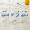 Three clear glasses with Geneva Lake Wisconsin map and compass design.