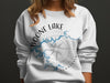 White sweatshirt with Boone Lake Tennessee map and compass design.