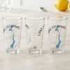 Three clear pint glasses featuring "Lake Leelanau Michigan" and a blue map outline.