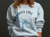 Light blue sweatshirt with blue Pickwick Lake map and compass graphic.