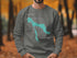 Dark gray sweatshirt with "Beautiful Charlevoix Michigan" and compass design.