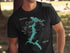 Black t-shirt with turquoise map of Lake Coeur d'Alene, Idaho and compass rose.