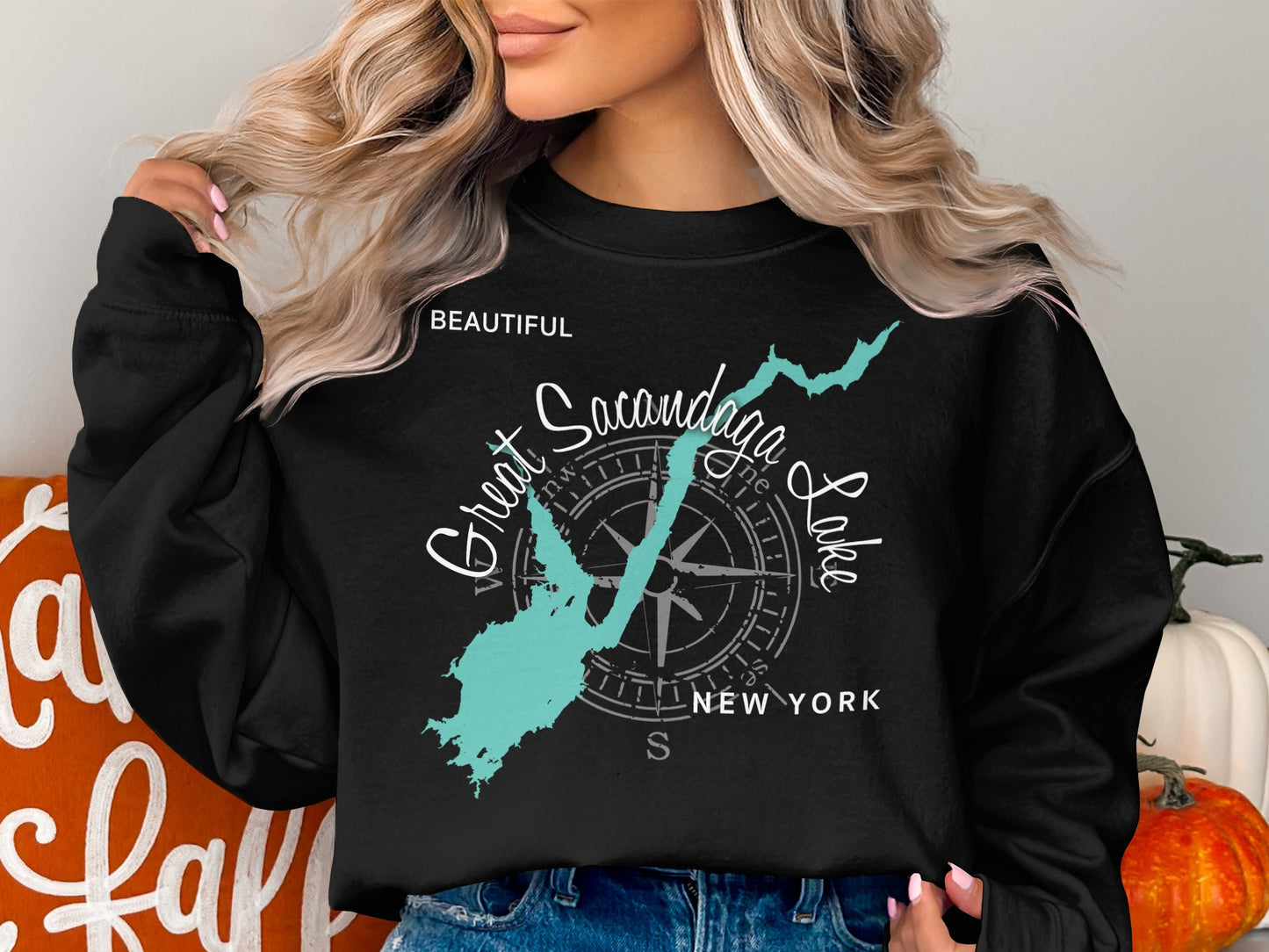 Black sweatshirt with turquoise outline of Sacandaga Lake and compass rose graphic.