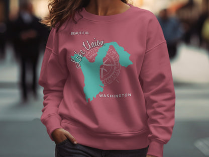 Pink sweatshirt with "Beautiful Lake Union Washington" map and compass graphic.