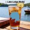 Glass with iced tea, lake outline, and "Lake Hefner" text beside a book.