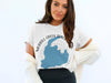 White t-shirt with Merril Creek Reservoir map and compass graphic.