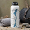 White water bottle with "CANYON" text, blue map shape, and compass design.