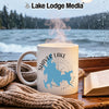 White mug with Shaver Lake California map and compass, by a window.