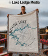 Boone Lake map on a fringed blanket held by a smiling man.
