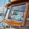 Turquoise Loch Raven Life sticker on boat window with Lake Lodge Media logo.
