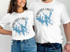 Two people wear white t-shirts with "Carters Lake Georgia" map and compass graphic.