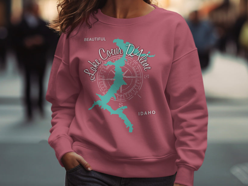 Pink sweatshirt with Lake Coeur d'Alene map and compass graphic.