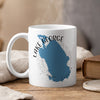 White mug with blue Lake George Florida map and compass design.