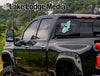 Black pickup truck rear window sticker "Carlyle Lake Life" with "Lake Lodge Media" logo.
