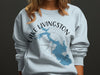 Light blue crewneck sweatshirt with Lake Livingston Texas map and compass design