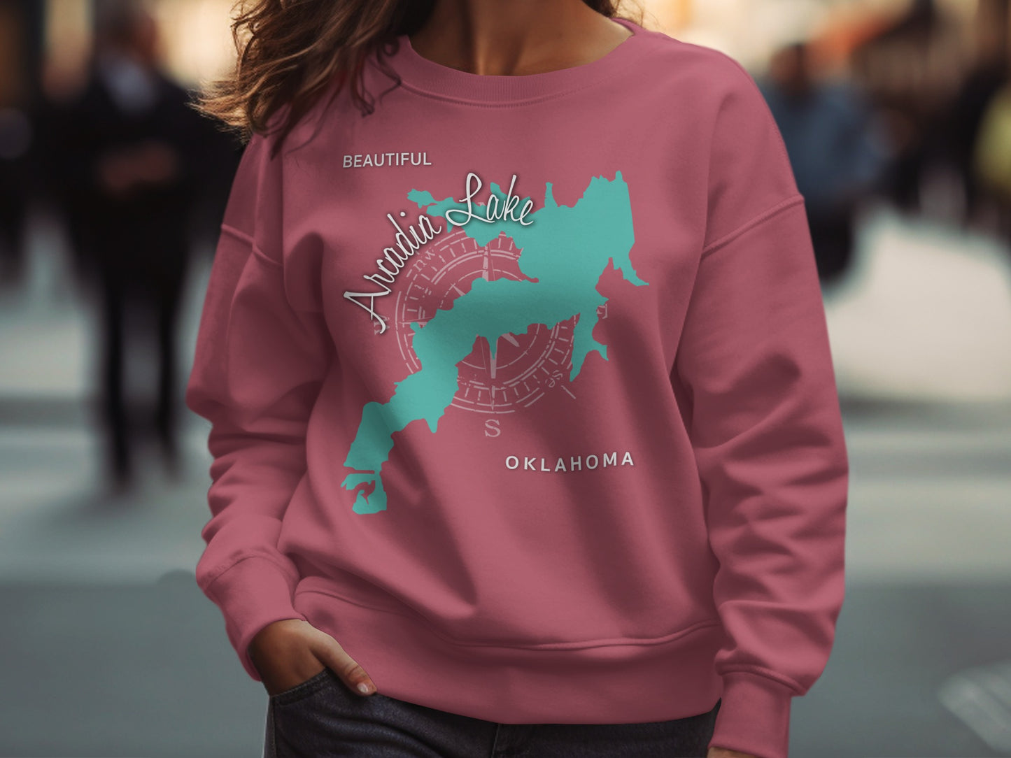 Pink sweatshirt with "Beautiful Arcadia Lake Oklahoma" map design.