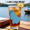 Glass with iced tea, lemon, and a blue map of "Winnipesaukee Lake" on a table.