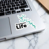 Tuscaloosa Life sticker with teal lake outline on a laptop.