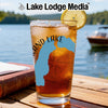 Glass of iced tea with blue Michigan outline and compass, on a wooden table.