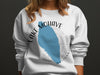 White sweatshirt with "Lake Mohave Arizona" print and compass design.