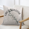 Pillow with Lake Tuscaloosa, Alabama map and compass design on a chair.