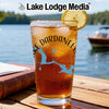 Glass of iced tea with a lemon slice, featuring a Dardanelle map and compass design.