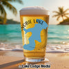 Beer glass on a beach with a map of Wolfeboro, New Hampshire.
