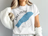 White t-shirt with "Lake Louise Banff" graphic and blue lake silhouette.