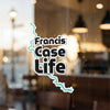 Francis Case Life sticker on glass with water outline and copyright text.