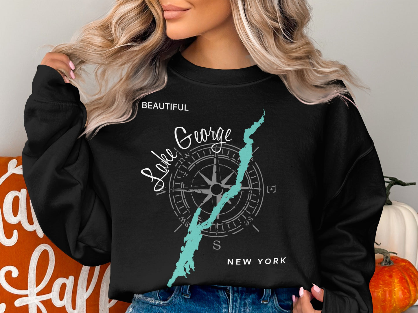 Black crewneck sweatshirt with Lake George compass graphic and "NEW YORK" text.