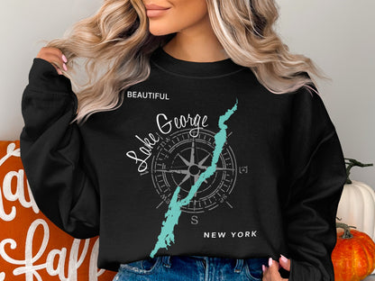 Black crewneck sweatshirt with Lake George compass graphic and "NEW YORK" text.