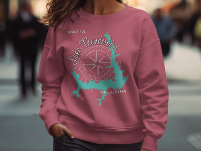 Pink sweatshirt with Lake Thunderbird Oklahoma map and compass graphic.