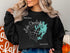 Black sweatshirt with "Beautiful Lake Charleston Ontario" compass design.
