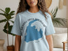 Light blue t-shirt featuring Merrill Creek Reservoir map and compass design with text.