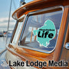 Turquoise Okeechobee Life sticker on a boat window, with Lake Lodge Media text below.