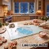 Glass cutting board with Lake Chaubunagungamaug map design on a kitchen counter with gingerbread cookies.