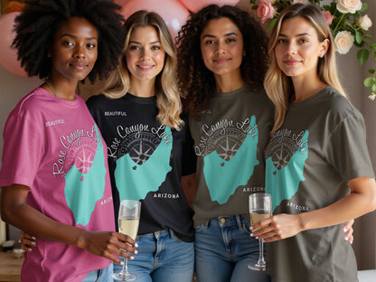 Four women in graphic tees featuring a turquoise map of Rose Canyon Lake, Arizona.