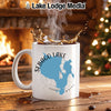 White mug with Sebago Lake, Maine map and "Lake Lodge Media" logo.
