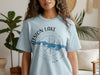 Light blue t-shirt with a compass design featuring "Oatsion Lake" and "New Jersey".