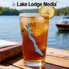Glass of iced tea with Maine map and compass design, "Lake Lodge Media" logo.