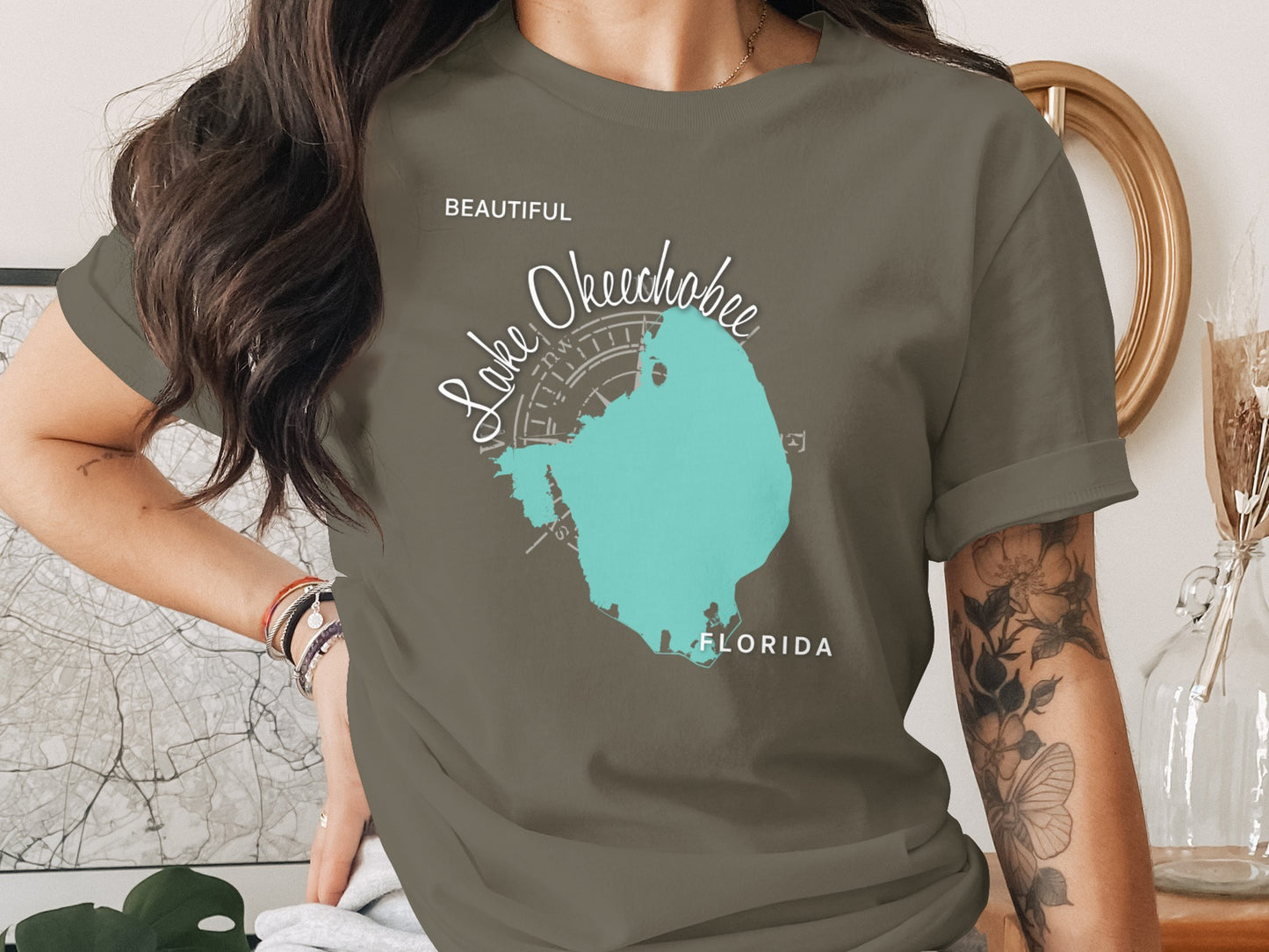 Olive green t-shirt featuring a teal map of Lake Okeechobee, Florida.