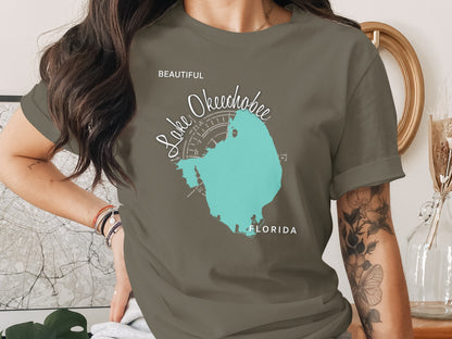 Olive green t-shirt featuring a teal map of Lake Okeechobee, Florida.