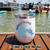 A white insulated tumbler with Marco Island Florida graphic sitting on a wooden boat deck.