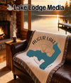 Augur Lake New York map and compass design on a fringed throw blanket.